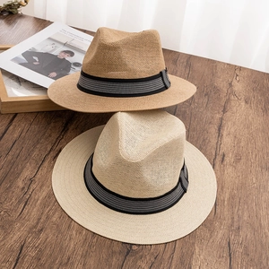 Classic wide brim straw sun hats in beige and light brown with striped ribbon bands