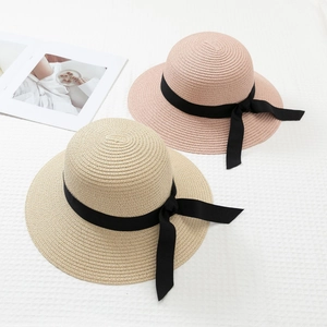 Minimalist wide brim straw sun hats with black ribbon bow for summer beach vacation