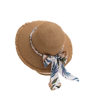 Women's woven straw sun hat with pearl beads and tropical floral print silk ribbon