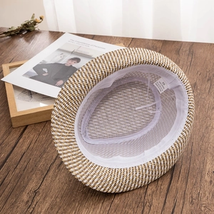 Detail of interior straw fedora showing 100% paper material label and sweatband