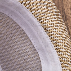 Detailed close-up of woven fedora hat texture with sweatband and stitching