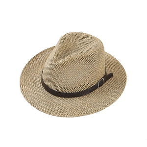 Detail of woven straw fedora with dark brown leather band and silver buckle accent