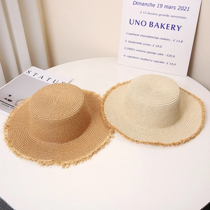 Flat top straw sun hats for women with frayed edges in khaki and beige for beach travel