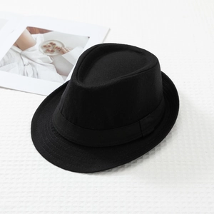 Close-up of black felt fedora hat with ribbed decorative band and textured felt finish