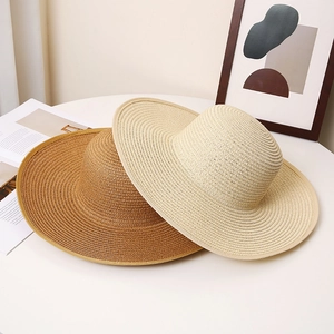 Stylish wide-brim straw sun hats in beige and tan for summer outdoor protection