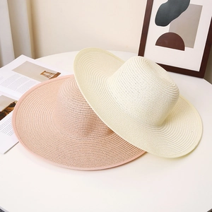 Wide brim woven straw sun hat for women in cream and pink, perfect for summer beach holidays