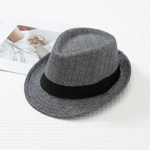 Detailed view of grey herringbone woven fedora hat with black grosgrain ribbon