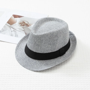 Detail of grey fedora hat featuring breathable woven texture and black ribbon band