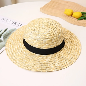 Minimalist straw sun hat with black ribbon, perfect for summer beach and vacation wear
