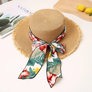 Flat top straw sun hat with floral bow ribbon and frayed brim for beach vacation