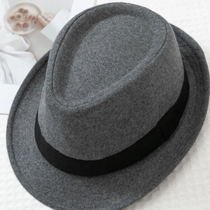 Detail view of grey felt fedora with black grosgrain ribbon and classic pinched crown