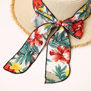 Women's woven straw sun hat with floral bow ribbon and frayed brim for beach vacation