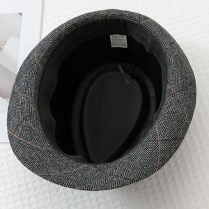 Detail view of herringbone jazz hat inner lining with 58cm size label and fabric composition