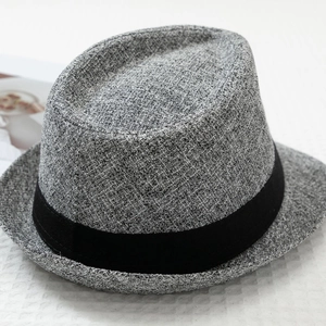 Detailed view of the grey woven texture and black ribbon trim on this classic fedora hat