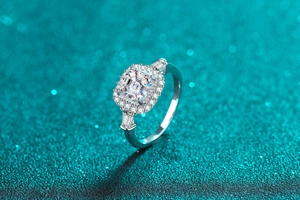 Macro shot of S925 sterling silver ring with square-cut moissanite and halo setting