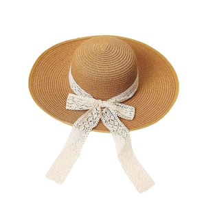 Summer wide brim straw sun hat for women with elegant white lace ribbon bow detail