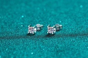Macro shot of S925 sterling silver bull-head stud earrings with moissanite crystal detail