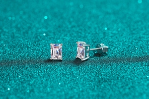 Macro detail of S925 sterling silver stamp on emerald cut moissanite stud earrings