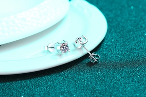Macro view of S925 sterling silver stud earrings with moissanite in a U-shaped setting