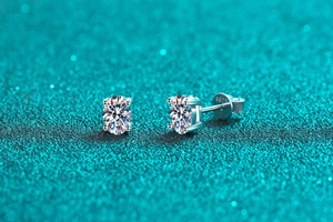 Macro view of S925 sterling silver stud earrings featuring four-prong solitaire stones