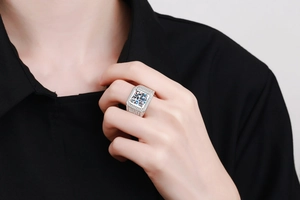 Macro shot of a large square-cut moissanite silver ring for men with side accent diamonds