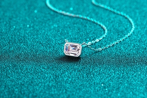Close-up of S925 sterling silver necklace with emerald-cut moissanite stone pendant