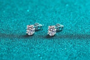 Macro shot of S925 sterling silver stamp on the classic 4-claw round moissanite stud earring