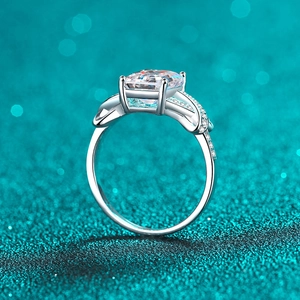 Elegant S925 sterling silver ring with 3 carat emerald-cut moissanite on teal background