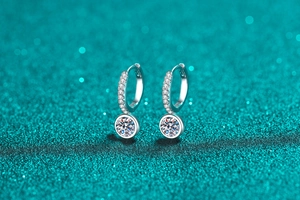 Macro view of S925 sterling silver hoop earrings with sparkling moissanite stones