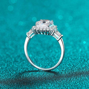 Luxurious S925 sterling silver ring with rectangular moissanite on a sparkling background