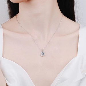 Elegant S925 sterling silver necklace with emerald cut moissanite on a female model
