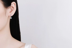Close-up of S925 sterling silver hoop earrings with brilliant moissanite stone