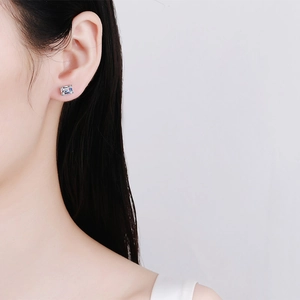 Minimalist S925 sterling silver stud earrings with emerald-cut moissanite on model