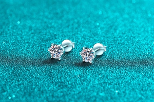 Macro shot of S925 sterling silver 6-claw moissanite stud earrings with screw backs