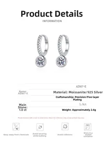 Macro shot of 925 silver moissanite earrings with technical specs and care icons
