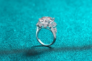 Macro shot of a 10-carat Moissanite ring with heart-shaped side stones and 6-prong setting