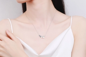Elegant S925 sterling silver necklace with freshwater pearl pendant worn by model on neck