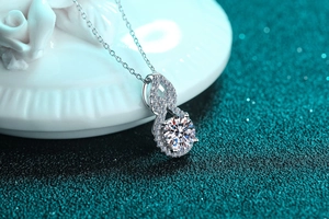 Macro shot of S925 sterling silver infinity pendant with sparkling moissanite gemstone