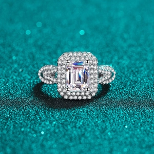 Luxurious S925 silver ring featuring emerald cut moissanite with twisted pavé band
