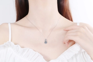 Detail of S925 silver gourd necklace featuring a brilliant moissanite pendant on neck
