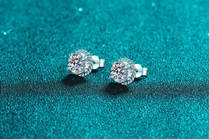 Macro detail of S925 sterling silver stud earrings with round moissanite gemstones