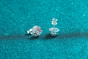 Detail view of S925 sterling silver stud earrings with moissanite in six-prong crown setting
