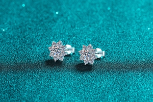 Macro shot of S925 sterling silver snowflake earrings with moissanite stones