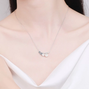 Elegant S925 sterling silver necklace with double pearls and blue moissanite on model