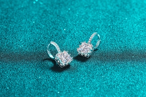 Macro shot of S925 sterling silver hoop earrings with princess cut moissanite stones
