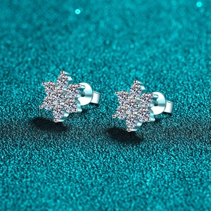 Sparkling S925 sterling silver moissanite sunflower stud earrings on glittery background
