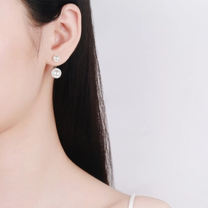 Elegant S925 silver double pearl earrings featuring moissanite accents on model