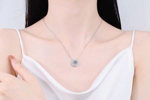 Close-up of elegant S925 sterling silver double circle necklace with moissanite pendant