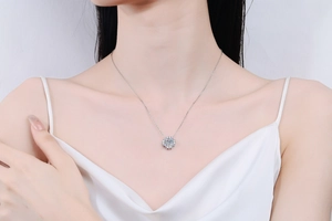 Close-up of S925 sterling silver necklace with a sparkling Moissanite halo pendant