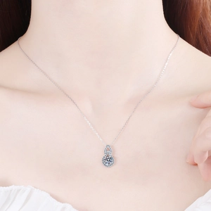 S925 sterling silver gourd necklace with moissanite pendant worn on model neck